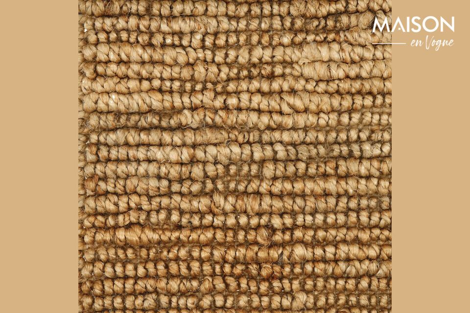 Crafted from the robust and natural fibers of jute, this rug exemplifies sustainable luxury