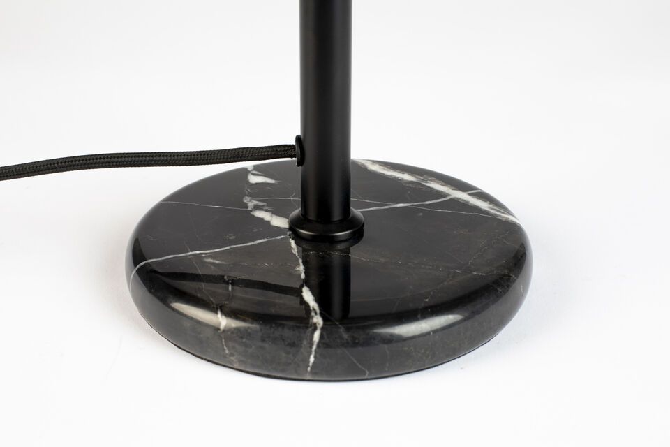 The base of the lamp is crafted from luxurious black marble